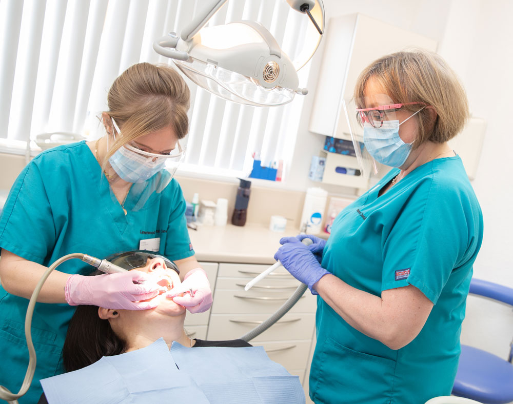 Patient in dental chair with our dentist