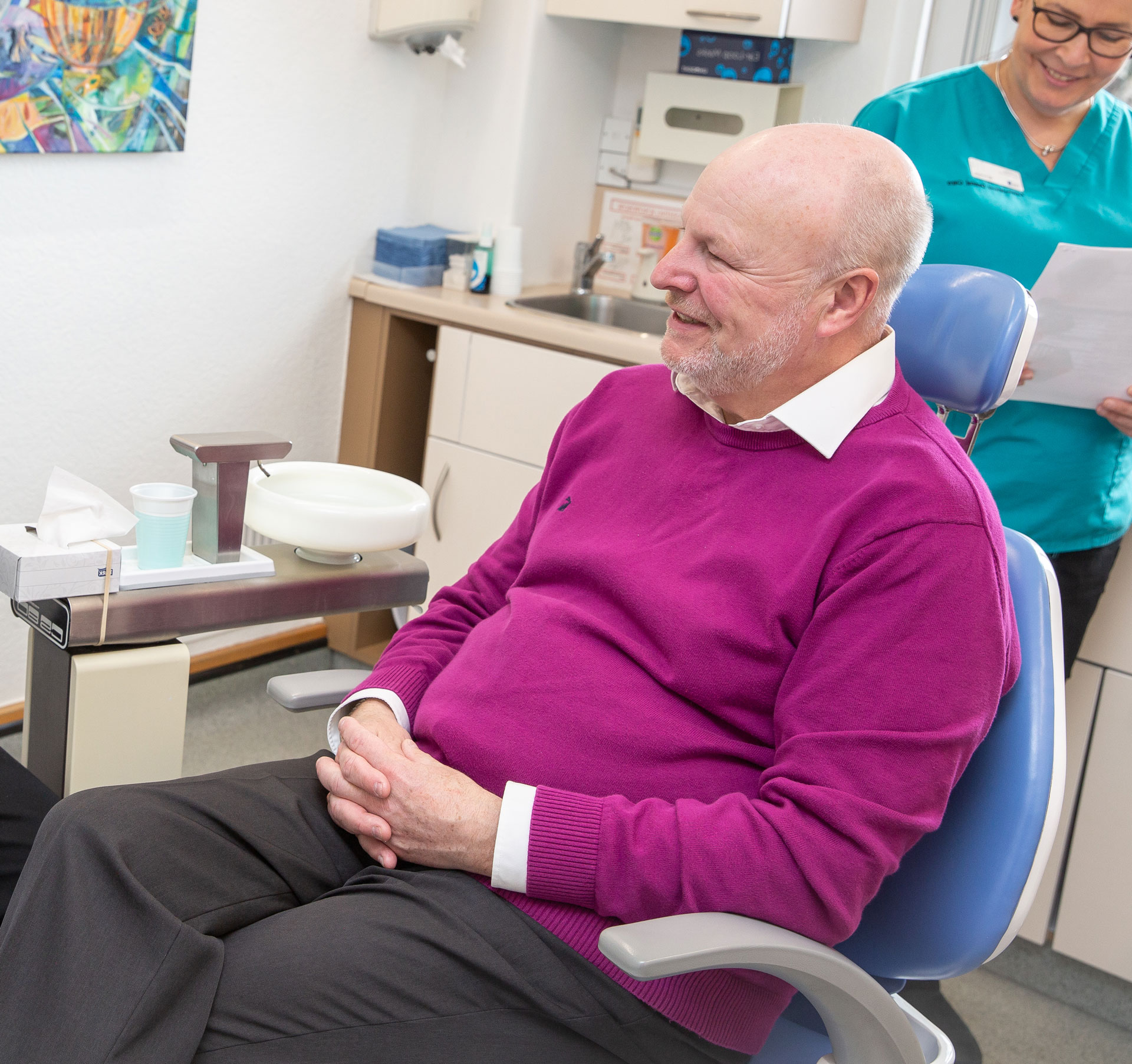 Happy patient in dental chair