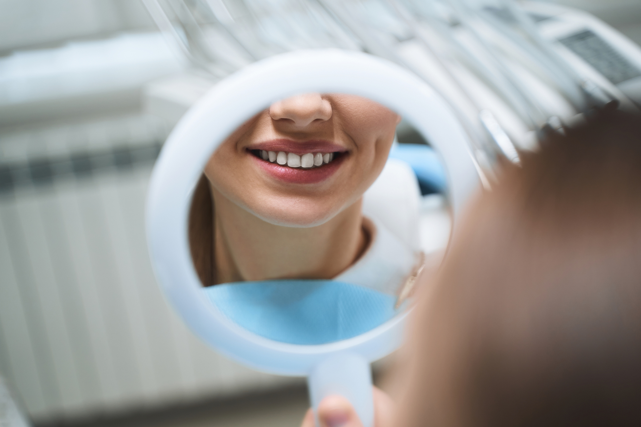 Woman with mirror at dentist