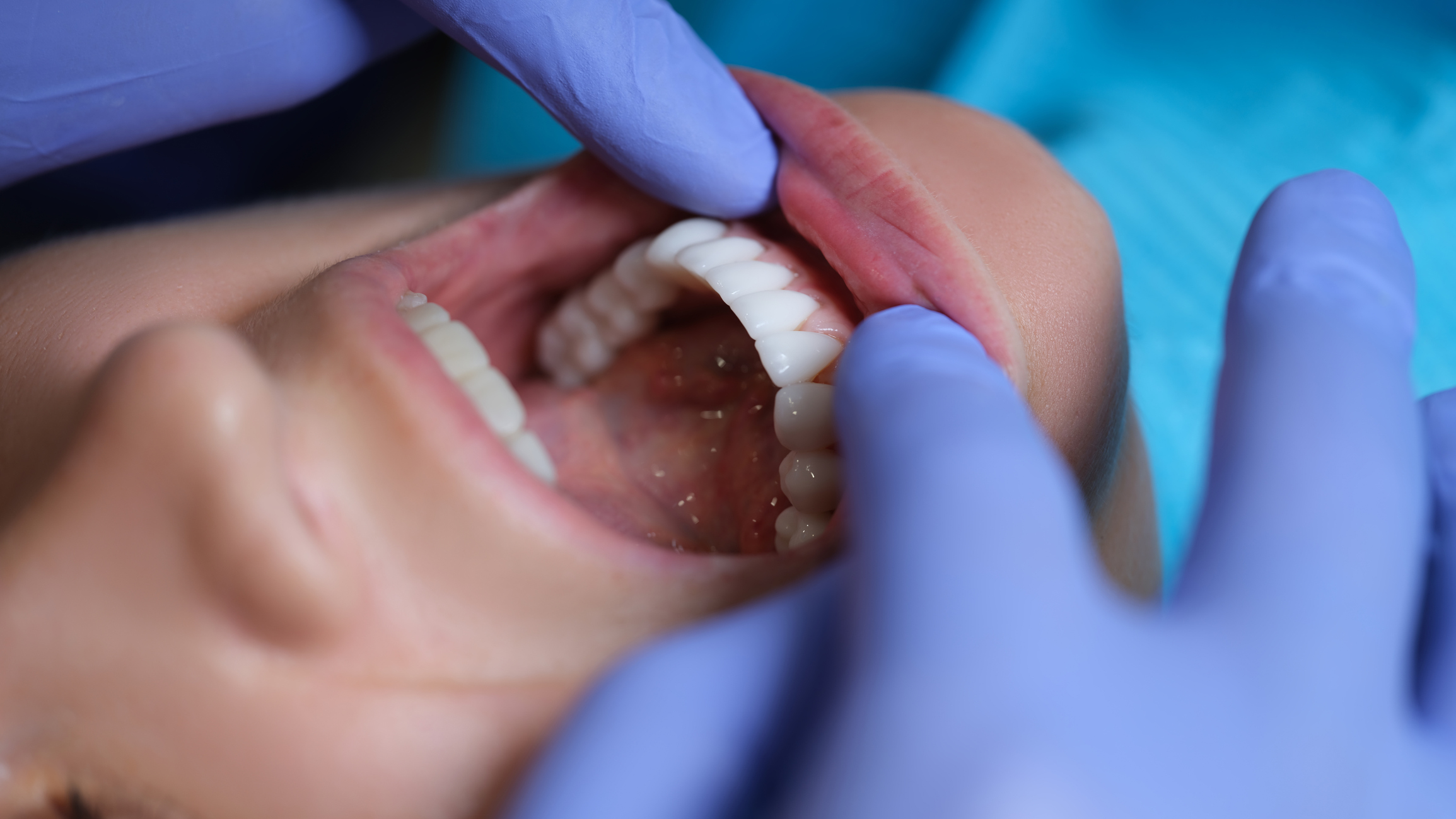 Doctor dentist examining patient