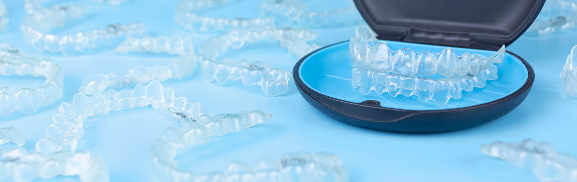 Invisible retainers case with orthodontic aligner brackets